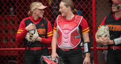 Senior third baseman Kori Stonestreet talks with junior catcher Gracie Sullivan in the pre-game huddle before their game against the Washburn Ichabods on Saturday, April 15 at the Pitt State Softball Complex.